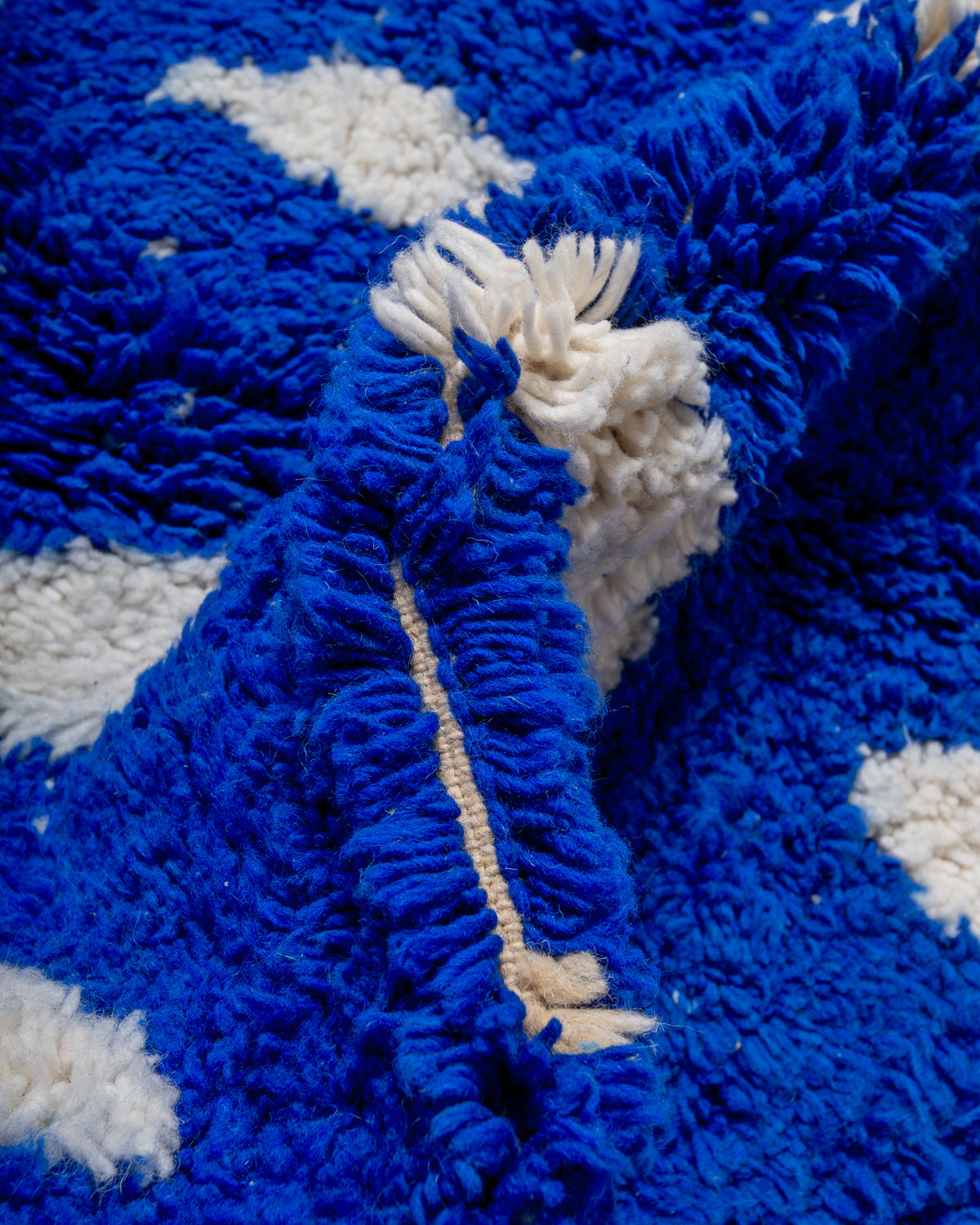 Modern, designer, handcrafted Berber rug from Morocco. Beniourain carpet with beautiful colours and patterns and fluffy wool texture.